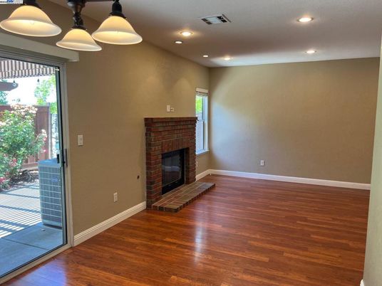 Empty room, Fireplace, Interior, Pendant Lights, Recessed Lighting, Wood Texture Flooring