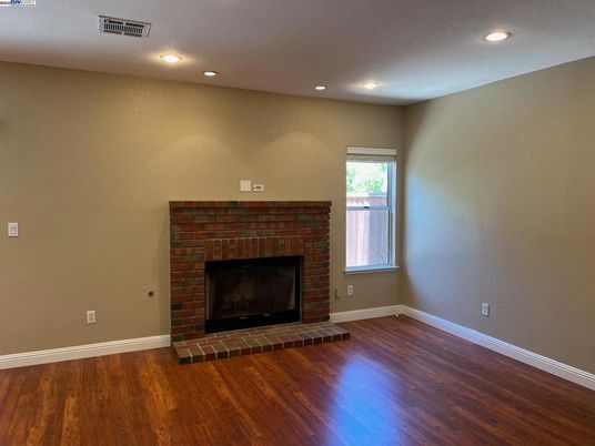 Empty room, Fireplace, Interior, Recessed Lighting, Wood Texture Flooring