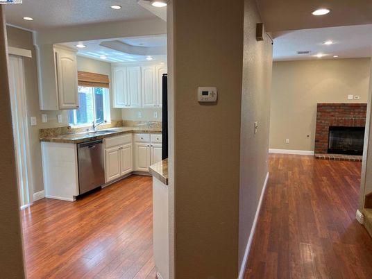 Fireplace, Interior, Kitchen, Recessed Lighting, Stone Walls, Wood Texture Flooring