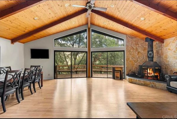 Dining room, Fireplace, Interior, Recessed Lighting, Stone Walls, Wooden Beams, Wooden Ceilings, Wood Texture Flooring