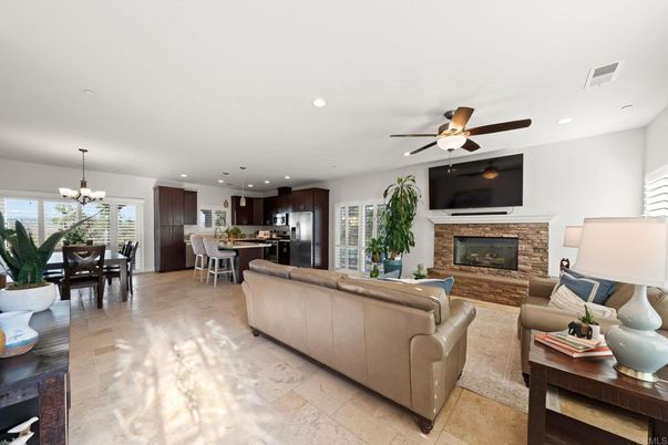 Chandelier, Dining room, Fireplace, Interior, Kitchen, Living room, Recessed Lighting, Stainless Steel Appliances