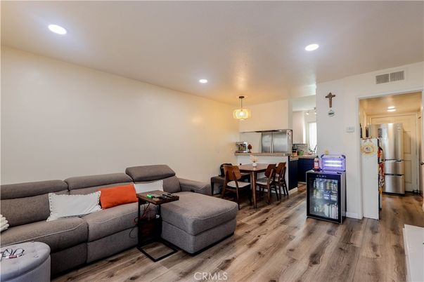 Dining room, Interior, Kitchen, Living room, Pendant Lights, Recessed Lighting, Stainless Steel Appliances, Wood Texture Flooring