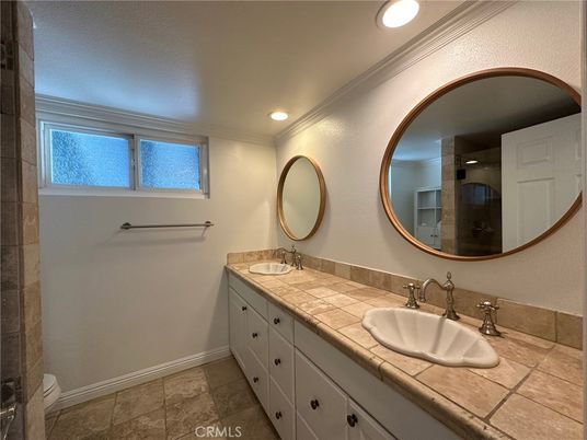 Bathroom, Dual Sink Vanities, Interior, Recessed Lighting, Tile Countertops