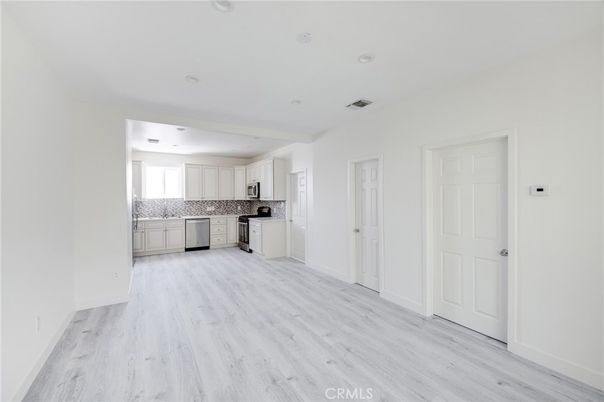 Empty room, Interior, Kitchen, Stainless Steel Appliances, Wood Texture Flooring