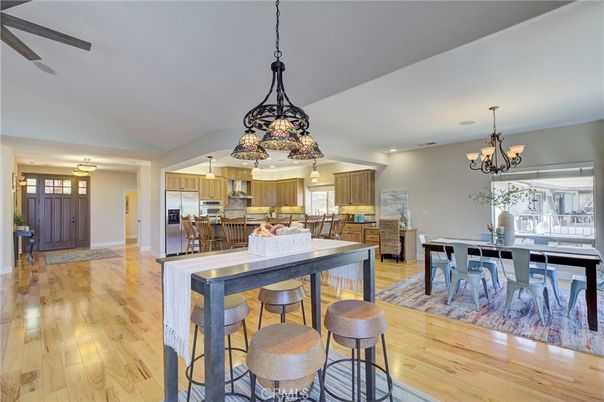 Chandelier, Dining room, Interior, Kitchen, Pendant Lights, Recessed Lighting, Stainless Steel Appliances, Wood Texture Flooring
