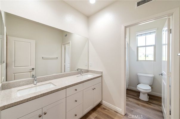 Bathroom, Dual Sink Vanities, Interior, Recessed Lighting, Wood Texture Flooring