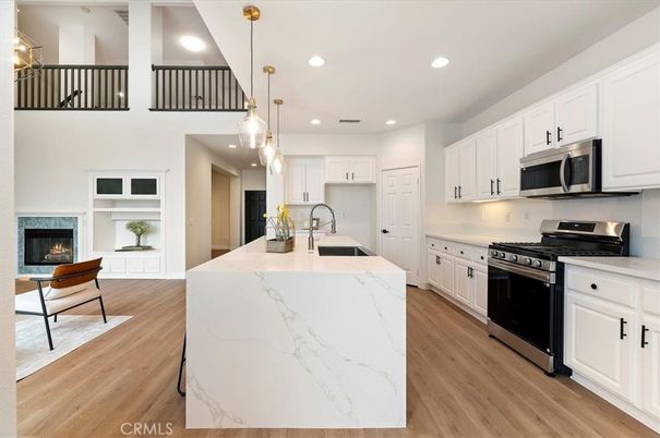 Fireplace, Interior, Kitchen, Pendant Lights, Recessed Lighting, Stainless Steel Appliances, Wood Texture Flooring
