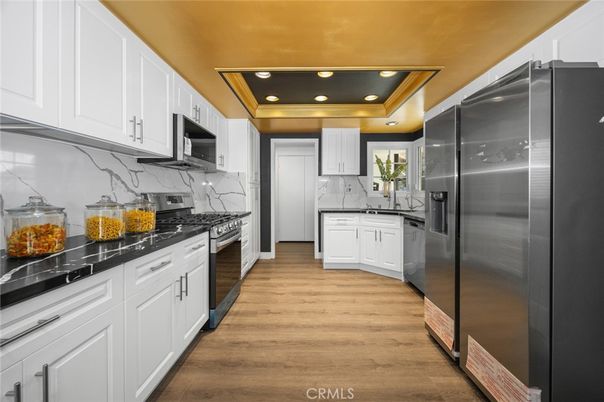 Interior, Kitchen, Marble Walls, Recessed Lighting, Stainless Steel Appliances, Wood Texture Flooring