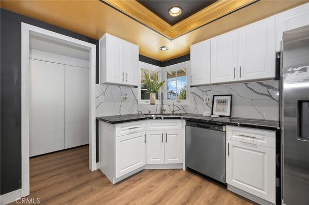 Interior, Kitchen, Marble Walls, Recessed Lighting, Stainless Steel Appliances, Wood Texture Flooring