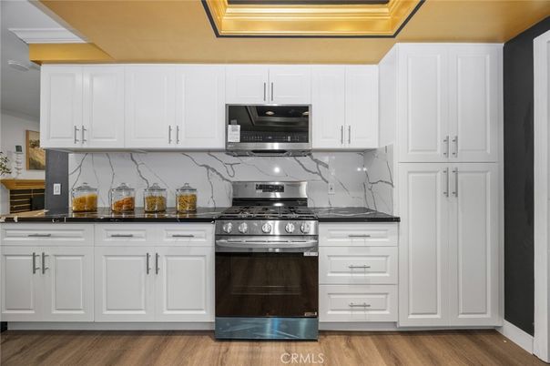 Interior, Kitchen, Marble Walls, Stainless Steel Appliances, Wood Texture Flooring