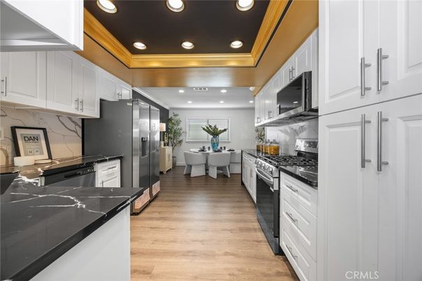 Dining room, Interior, Kitchen, Marble Walls, Recessed Lighting, Stainless Steel Appliances, Wood Texture Flooring