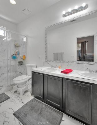 Bathroom, Dual Sink Vanities, Glass Shower, Interior, Marble, Marble Walls, Recessed Lighting