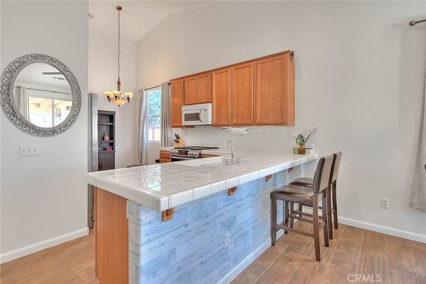 Chandelier, Interior, Kitchen, Pendant Lights, Tile Countertops, Wood Texture Flooring