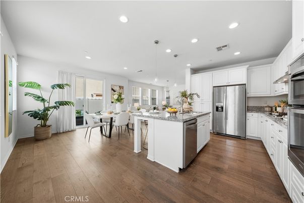 Dining room, Interior, Kitchen, Pendant Lights, Recessed Lighting, Stainless Steel Appliances, Wood Texture Flooring