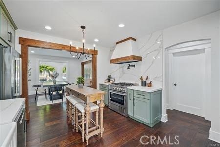Chandelier, Dining room, Interior, Kitchen, Marble Walls, Recessed Lighting, Stainless Steel Appliances, Wooden Beams, Wood Texture Flooring