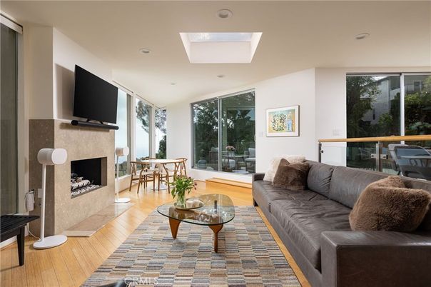 Dining room, Fireplace, Interior, Living room, Recessed Lighting, Wood Texture Flooring