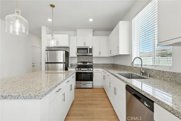 Interior, Kitchen, Pendant Lights, Recessed Lighting, Stainless Steel Appliances, Wood Texture Flooring