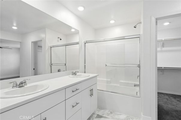 Bathroom, Dual Sink Vanities, Glass Shower, Interior, Marble, Recessed Lighting, Walk-in Closets