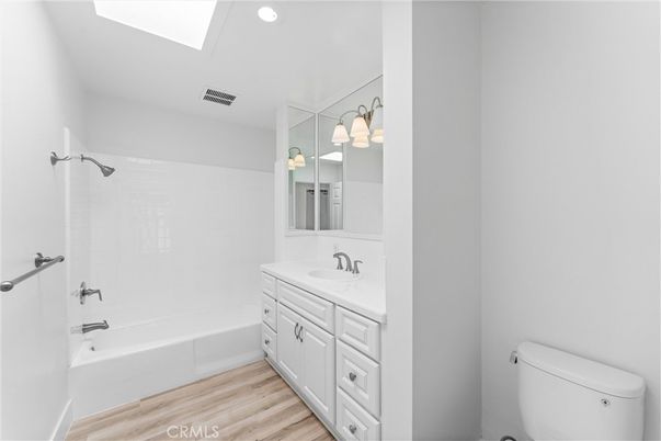 Bathroom, Dual Sink Vanities, Interior, Recessed Lighting, Wood Texture Flooring