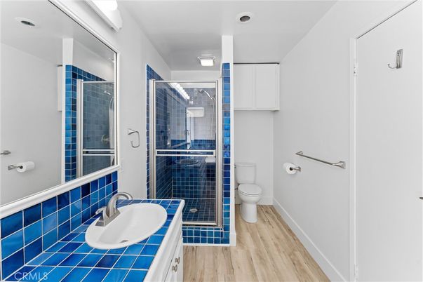 Bathroom, Glass Shower, Interior, Tile Countertops, Wood Texture Flooring