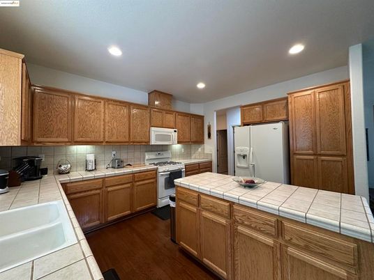 Interior, Kitchen, Recessed Lighting, Tile Countertops, Wood Texture Flooring