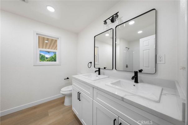 Bathroom, Dual Sink Vanities, Interior, Recessed Lighting, Wood Texture Flooring