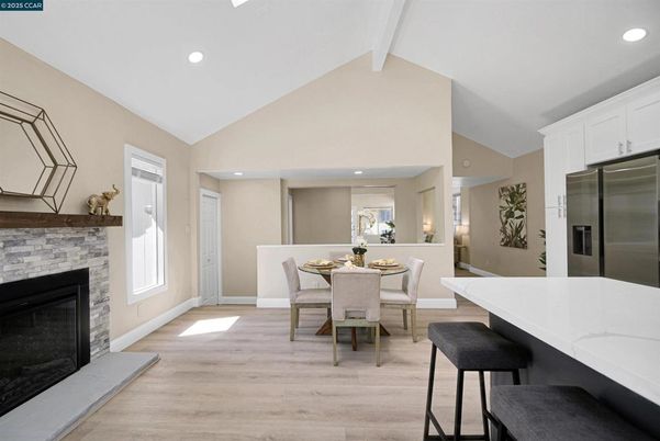 Dining room, Fireplace, Interior, Kitchen, Recessed Lighting, Stainless Steel Appliances, Wood Texture Flooring