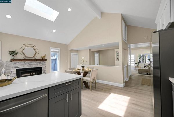 Dining room, Fireplace, Interior, Kitchen, Recessed Lighting, Wood Texture Flooring
