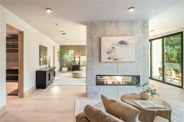 Fireplace, Interior, Living room, Marble Walls, Recessed Lighting, Wood Texture Flooring