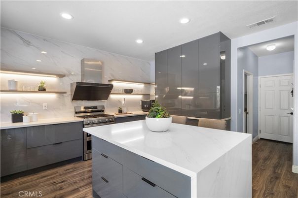 Interior, Kitchen, Marble Walls, Recessed Lighting, Stainless Steel Appliances, Wood Texture Flooring