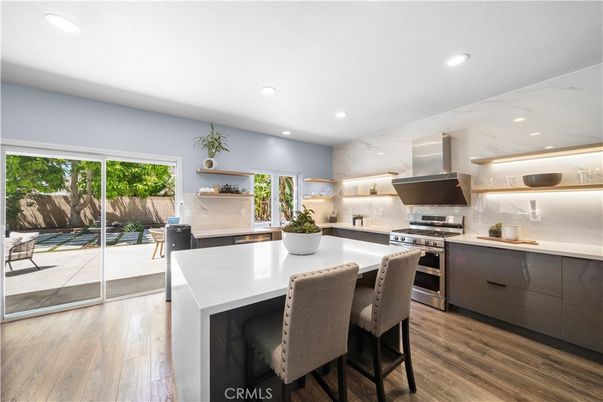 Interior, Kitchen, Marble Walls, Recessed Lighting, Stainless Steel Appliances, Wood Texture Flooring