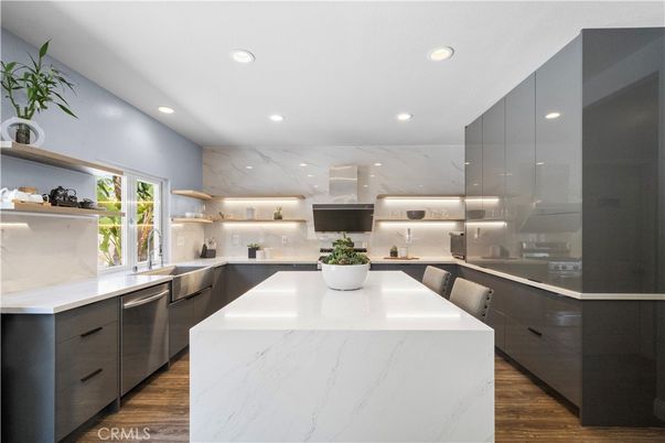Interior, Kitchen, Marble Walls, Recessed Lighting, Stainless Steel Appliances, Wood Texture Flooring