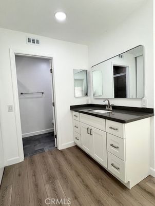 Bathroom, Dual Sink Vanities, Interior, Recessed Lighting, Wood Texture Flooring
