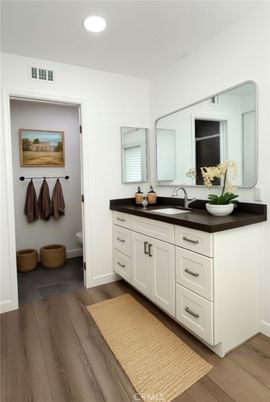 Bathroom, Dual Sink Vanities, Interior, Recessed Lighting, Wood Texture Flooring