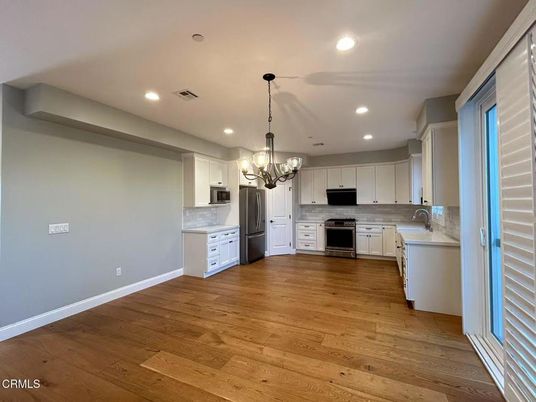 Chandelier, Interior, Kitchen, Recessed Lighting, Stainless Steel Appliances, Wood Texture Flooring