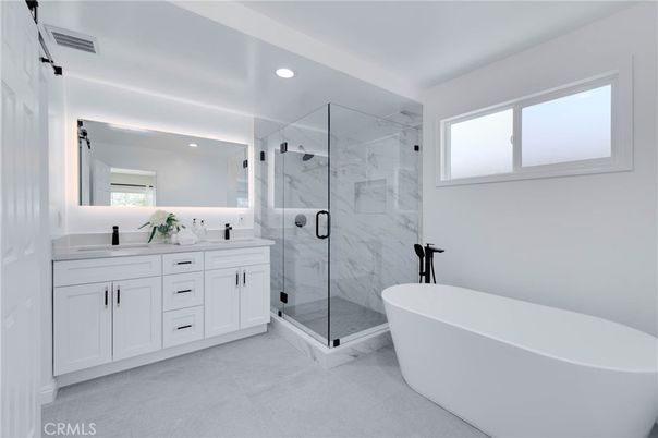 Bathroom, Dual Sink Vanities, Free Standing Baths, Glass Shower, Interior, Marble Walls, Recessed Lighting