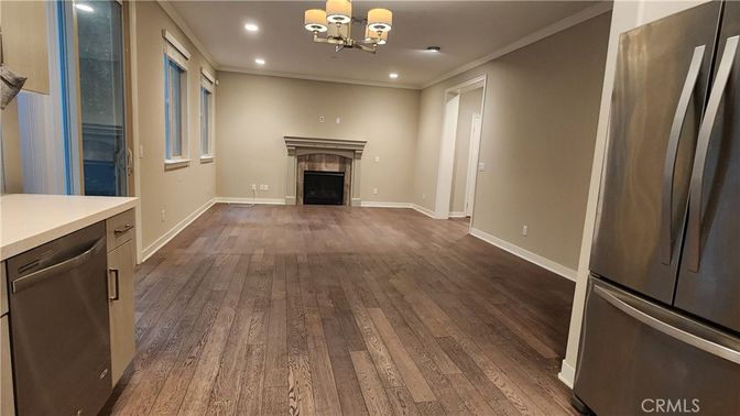 Chandelier, Empty room, Fireplace, Interior, Recessed Lighting, Wood Texture Flooring