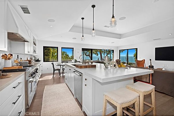 Dining room, Interior, Kitchen, Pendant Lights, Recessed Lighting, Stainless Steel Appliances, Water, Wood Texture Flooring