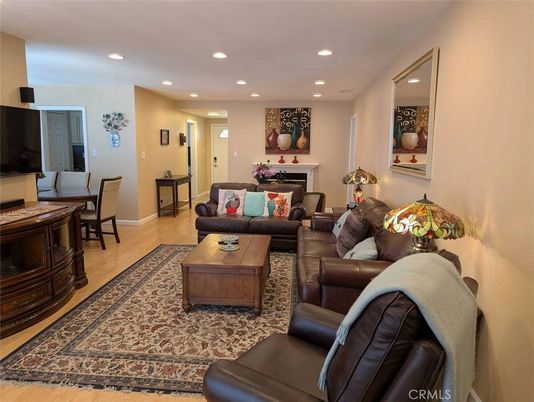Dining room, Fireplace, Interior, Living room, Recessed Lighting, Wood Texture Flooring
