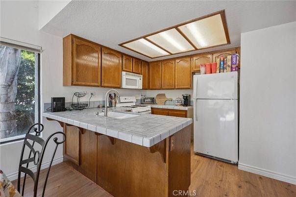Interior, Kitchen, Tile Countertops, Wood Texture Flooring