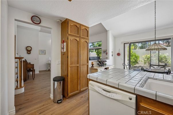 Interior, Kitchen, Pendant Lights, Tile Countertops, Wood Texture Flooring