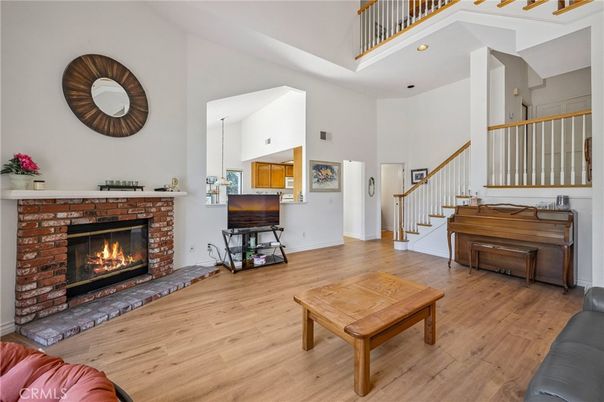 Fireplace, Interior, Pendant Lights, Piano, Recessed Lighting, Wood Texture Flooring