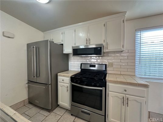 Interior, Kitchen, Stainless Steel Appliances, Tile Countertops