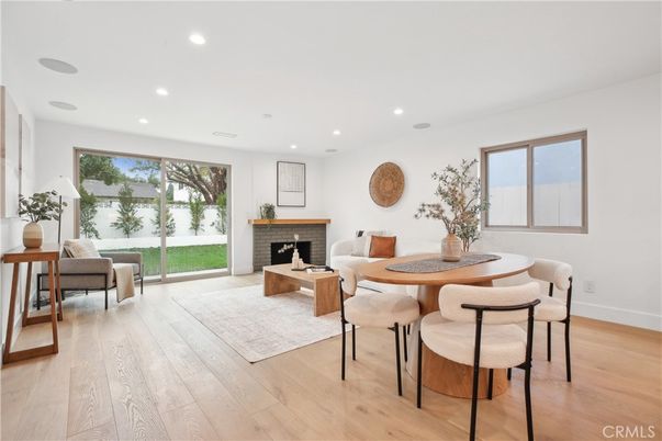 Dining room, Fireplace, Interior, Living room, Recessed Lighting, Wood Texture Flooring