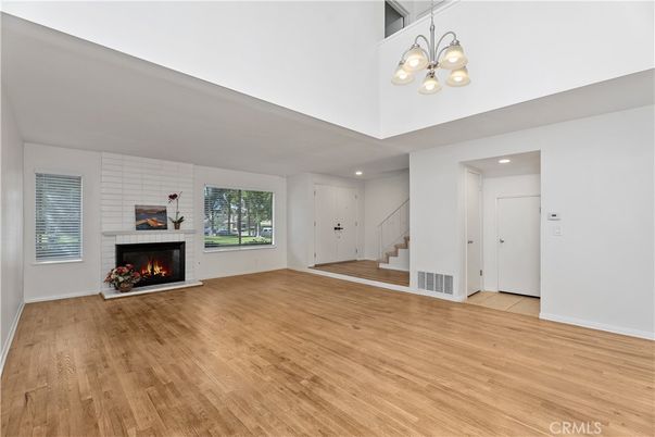 Empty room, Fireplace, Interior, Recessed Lighting, Wood Texture Flooring