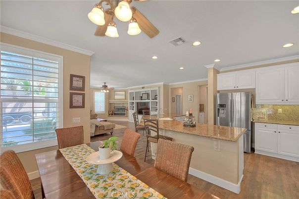 Dining room, Fireplace, Interior, Kitchen, Living room, Recessed Lighting, Stainless Steel Appliances, Wood Texture Flooring