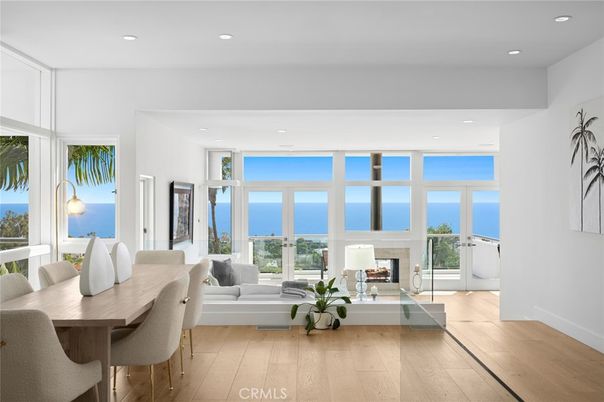Dining room, Fireplace, Interior, Living room, Recessed Lighting, Water, Wood Texture Flooring