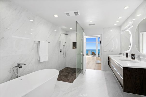 Bathroom, Dual Sink Vanities, Free Standing Baths, Glass Shower, Interior, Marble, Marble Walls, Recessed Lighting, Water