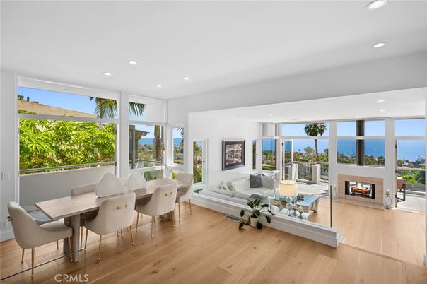 Dining room, Fireplace, Interior, Living room, Recessed Lighting, Water, Wood Texture Flooring