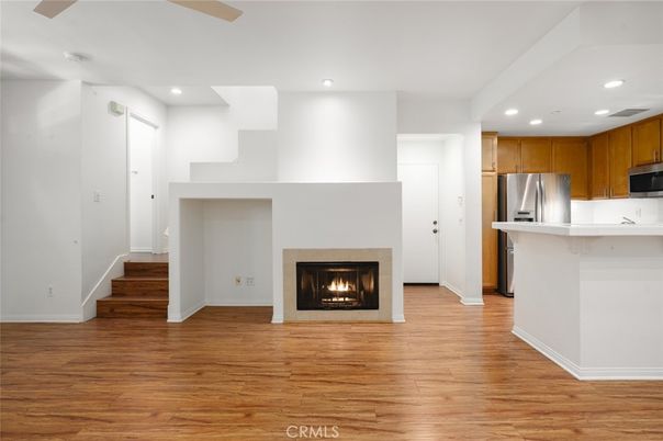 Fireplace, Interior, Kitchen, Recessed Lighting, Stainless Steel Appliances, Wood Texture Flooring